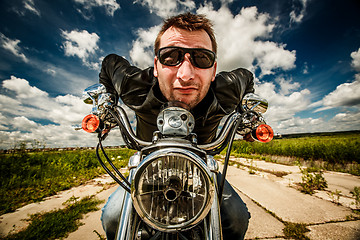 Image showing Funny Biker racing on the road