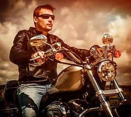 Image showing Biker on a motorcycle