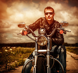 Image showing Biker on a motorcycle