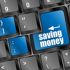 Image showing save money for investment concept with a blue button on computer keyboard