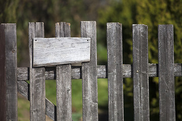 Image showing Wooden fence with empty sign board