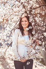 Image showing Pregnant woman in the flowering branches