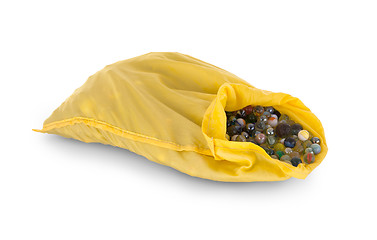 Image showing Assorted black glass marbles arranged in a yellow pouch