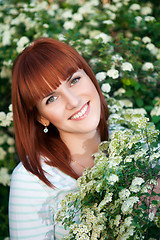 Image showing Red-haired smiling woman