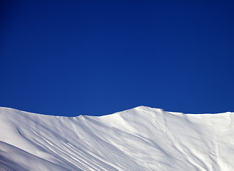 Image showing Off-piste slope and blue clear sky in nice winter day
