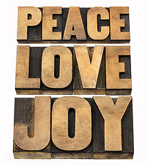 Image showing peace, love and joy in wood type