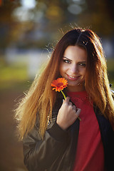 Image showing Girl with a flower