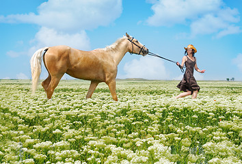 Image showing Running woman and horse