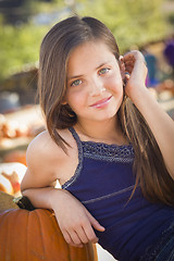 Image showing Preteen Girl Portrait at the Pumpkin Patch