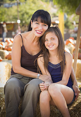 Image showing Attractive Mother and Daughter Portrait at the Pumpkin Patch
