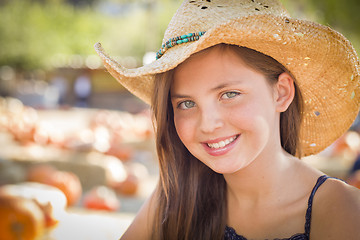 Image showing Preteen Girl Portrait Wearing Cowboy Hat at Pumpkin Patch