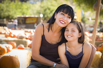 Image showing Attractive Mother and Daughter Portrait at the Pumpkin Patch
