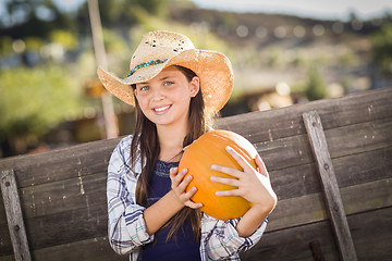 Image showing Preteen Girl Portrait at the Pumpkin Patch