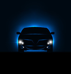 Image showing Silhouette of car with headlights in darkness 