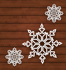 Image showing Set snowflakes on wooden background