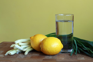 Image showing Lemons, onion and glass of water