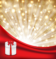 Image showing Gift box with red bow on glowing background