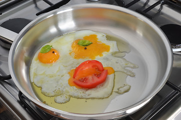 Image showing Frying eggs