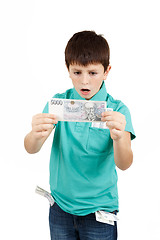 Image showing amazed boy looks at the bill