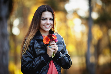 Image showing Girl with a flower