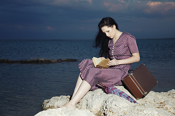 Image showing Reading at sunset