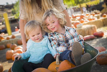 Image showing Young Family Enjoys a Day at the Pumpkin Patch