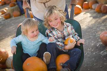 Image showing Young Family Enjoys a Day at the Pumpkin Patch