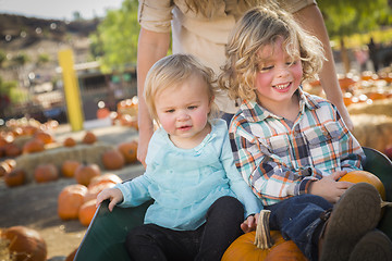 Image showing Young Family Enjoys a Day at the Pumpkin Patch