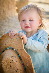 Image showing Adorable Baby Girl with Cowboy Hat at the Pumpkin Patch
