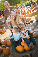 Image showing Young Family Enjoys a Day at the Pumpkin Patch