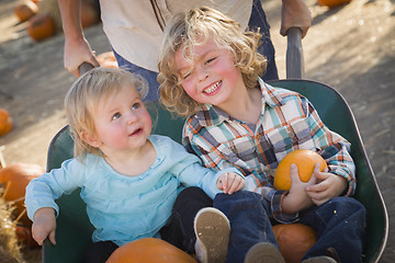 Image showing Young Family Enjoys a Day at the Pumpkin Patch