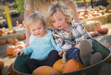 Image showing Young Family Enjoys a Day at the Pumpkin Patch