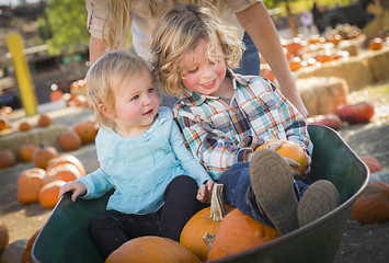 Image showing Young Family Enjoys a Day at the Pumpkin Patch