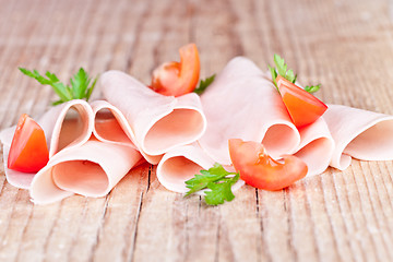 Image showing slices of ham with parsley and tomato 