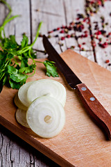 Image showing fresh sliced onion, peppercorns and parsley 