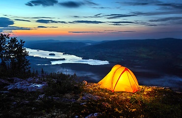 Image showing 	A tent lit up at dusk