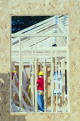 Image showing wood frame construction job seen trhough window opening