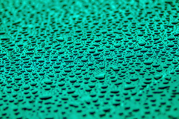 Image showing cyan drops on water-repellent surface