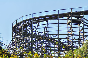 Image showing rollercoasters at an amusement park with blue sky