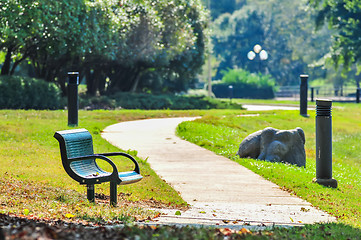 Image showing bench in a park with a walkway