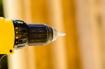 Image showing Powerful tip of a drill close up on a construction background