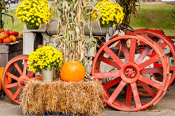 Image showing pumpkins next to an old farm tractor