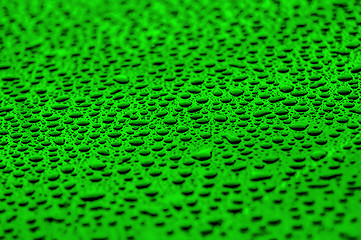 Image showing green drops on water-repellent surface