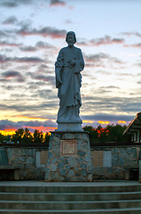 Image showing religious statue silhouette at sunset