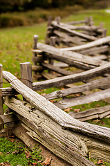 Image showing Beautiful Autumn scene showing rustic old log cabin surrounded b