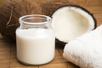 Image showing coconut fruit with a jar filled with coco milk