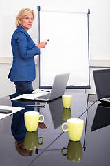 Image showing Business woman giving presentation