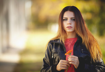 Image showing Girl with a flower