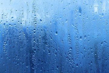 Image showing Natural water drops on glass