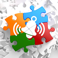 Image showing Ringing White Bell Icon on Multicolor Puzzle.